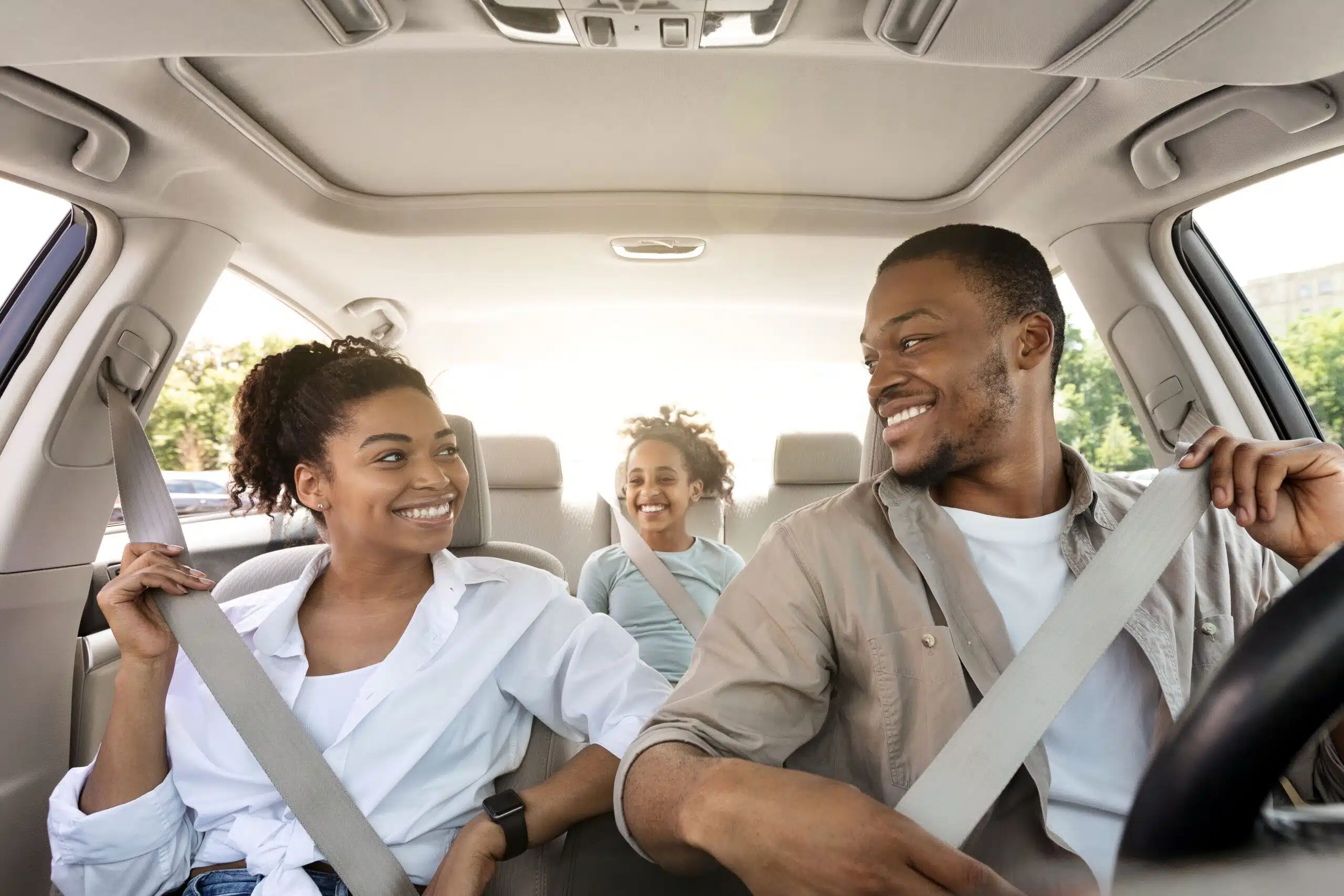 Joyful Family Riding In Car Enjoying Summer Road Trip From Quebec To Tobermory Together.